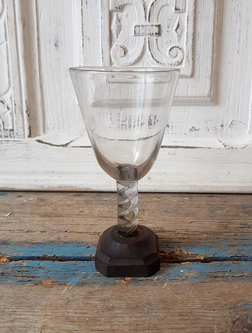 Norwegian 17th century glass on wooden stand.