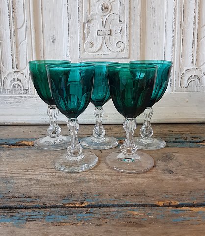 Beautiful white wine glass in crystal with dark green bowl.