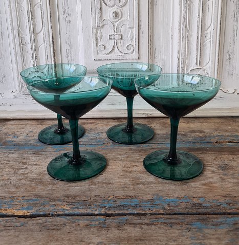 Set on four beautiful green cocktail glasses