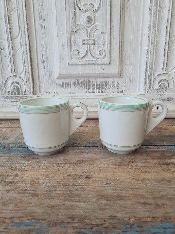 Pair of French café brûlot cups in strong iron porcelain decorated with green 
stripes