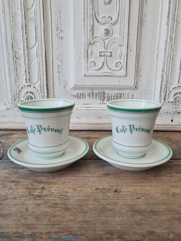 Pair of French café brûlot cups in strong iron porcelain decorated with green 
stripes and the text Café Prévost