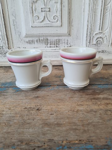 Pair of French café brûlot cups in strong iron porcelain decorated with bright 
red, black and gold stripes