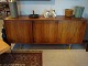 Low rosewood sideboard with steel legs. 5000m2 Showroom.