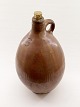 Brown glazed liquor bottle sold