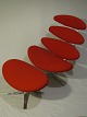 Corona lounge chair and footstool
Brushed steel and red wool 
Volther