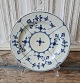 Royal Copenhagen Antique Blue Fluted plate ca year 1800.
Diameter 24 cm. 
Appears with chip.