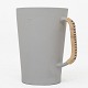Metha Stuart Wallace / Own workshop
Handmade stoneware jug with grey glaze and braided handle with grey stripe. 
Series 