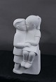 Stone Art white figurine from Marbell, The Netherlands. Couple of siblings on a 
bench.