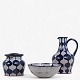 Gertrud Vasegaard
Unique set of 3 pieces. painted stoneware with ornamentation on thread in white 
and blue glaze. Consisting of bowl, lidded jar and jug. Signed.
1 pc. in stock
