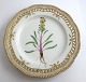 Royal Copenhagen, Flora Danica. Frokost tallerken med gennemskåret bort. Design 
#3554. Diameter 23 cm. (1 sortering). Pedicularis flammea L