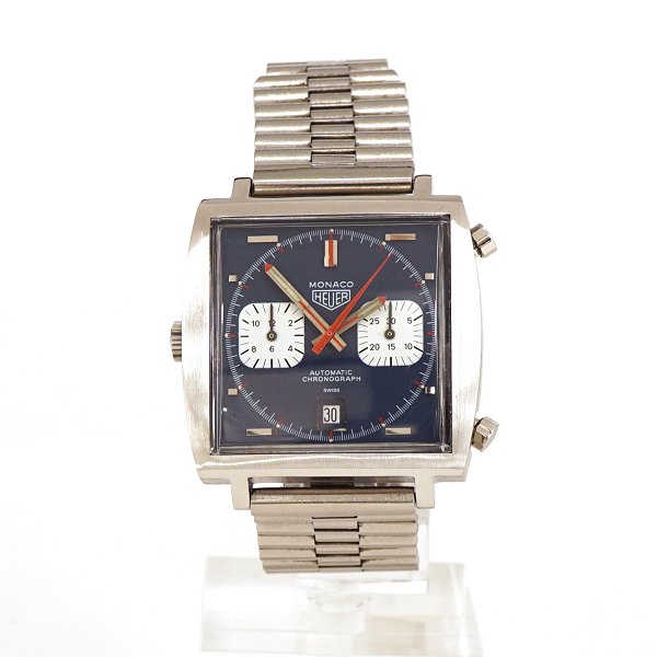 Seltene Heuer Monaco Ref 1133B Steve Mcqueen. Um 1970. Caliber 12. Automatik. 
Wird mit originaler Schachtel geliefert. Masse: 40x40mm
Sehr guter Zustand