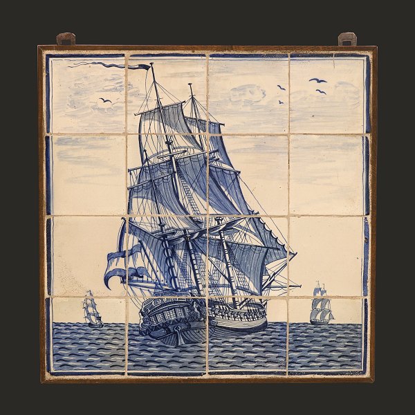 A large 19th century tile picture with a blue decorated ship. The Netherlands 
circa 1880. Size: 54,5x54,5cm