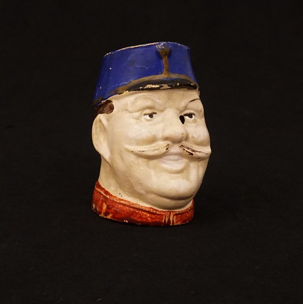 A pottery moneybox. Denmark circa 1900. H: 9cm