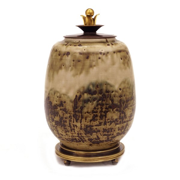 A Danish stoneware lidded jar by Carl Halier, 1873-1948, for Royal Copenhagen. 
Signed 1944. H: 26cm