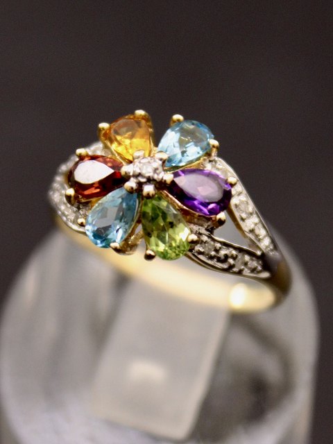 9 carat gold ring with various gemstones