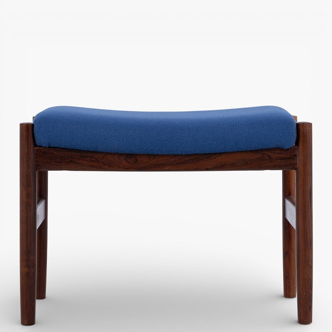 Spøttrup Furniture Factory.Footstool in patinated rosewood upholstered in blue wool.1 pc. in stock